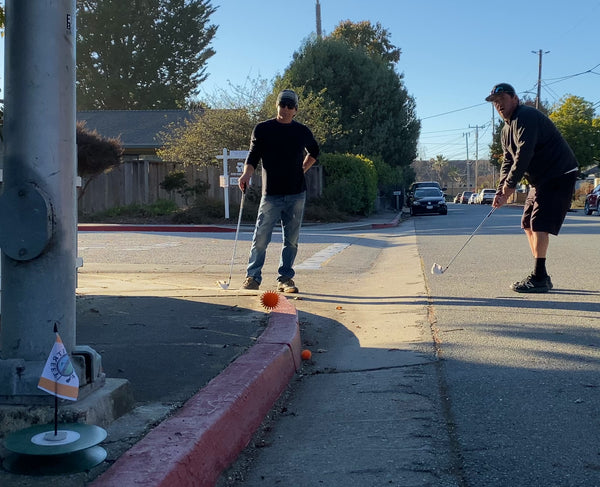 Chipping a Street Golf ball to the hole over the curb