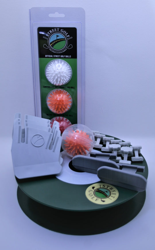 Complete package with 4 StreetTuf club covers, 1 Hill Holder Street Golf ball, 3 Street Golf balls in a pack, 1 Street Golf hole, 2 putting adapters, and 8 clamps